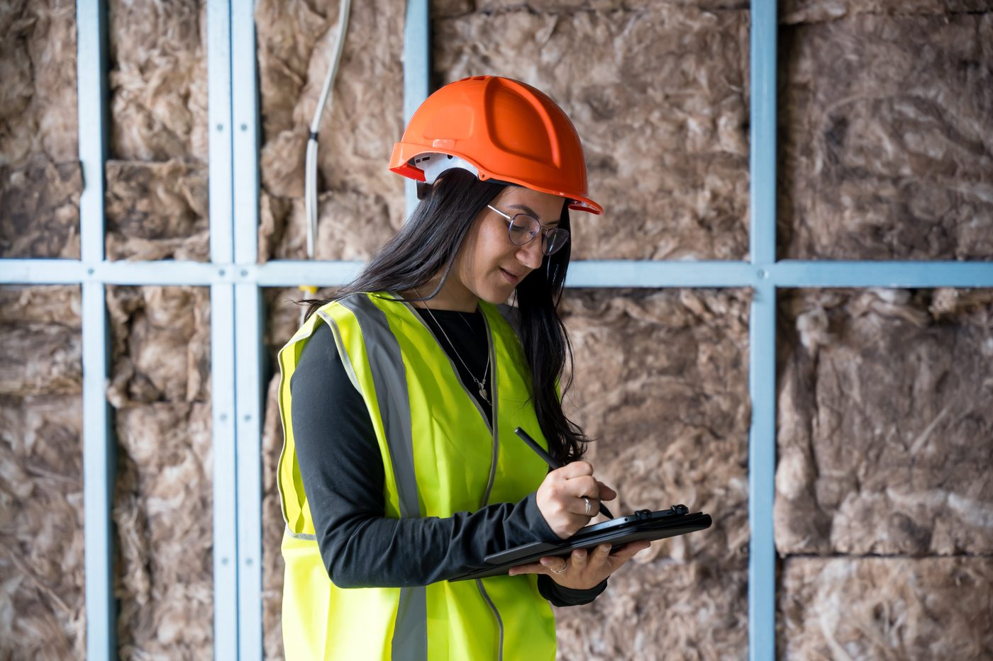 Energy Efficiency Skills Institute — insulation inspector assessing wall insulation installation